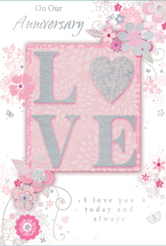 This anniversary card is photographed from above, allowing the full design to unfold like a delicate, pastel bouquet spread across the page, the kind a local Erith florist might draw inspiration from. At centre stage, the word LOVE rises from the surface in embossed letters, each stroke coated in a soft, frosted glitter. The glitter shimmers faintly between silver and pearl, creating a gentle sparkle rather than a bold shine, and the raised edges give the word a sculpted, almost carved look that the fingertips can trace. Behind and around the lettering lies a field of soft blush pink that gradually blends into creamier tones at the edges, like the blending of petals in a tightly clustered posy. Radiating from the central word, an arrangement of hand-drawn flowers and foliage flows outward in loose, organic curves. The blossoms appear in shades of blush pink, ivory, and cool grey, some with barely-there lilac undertones, and their fine, ink-like outlines suggest roses, simple garden flowers, and delicate buds. Thin stems and curling vines weave among them, reminiscent of the way a florist threads stems together when creating a romantic, cascading bouquet. Tiny accents of silver foil or metallic ink highlight certain petals and leaves, adding a subtle glint that echoes the glittered lettering. The background maintains a calm, powdery pink, like early morning light over Erith's parks and quiet cul-de-sacs. Elegant script text is placed thoughtfully within the design, carrying anniversary wishes and loving sentiments in a soft, grey tone that complements the artwork instead of competing with it. Overall, the card feels like a carefully crafted expression of enduring love, as gentle and considered as an anniversary bouquet delivered to a home in Erith.